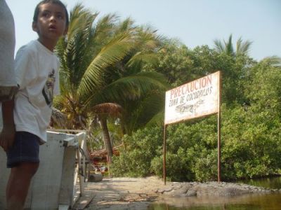The propane's expert has his head as full as our empty bottle. (Barra Potosis, Mexico)