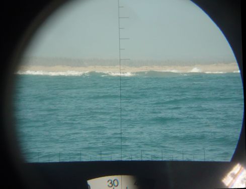 We switch off the fridge because it's damned cold in the boat. Big waves are breaking on the Baja Coast. (Punta San Christobol, Mexico)